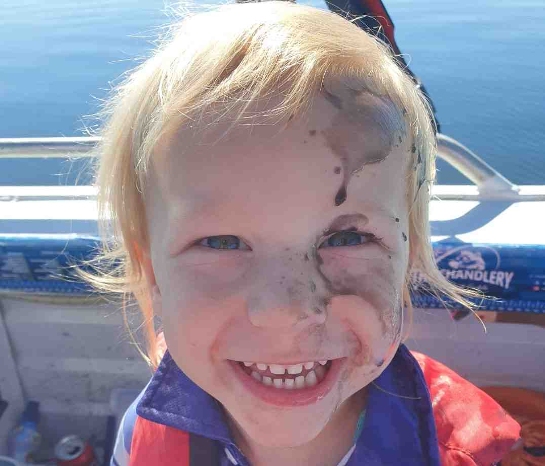 Grandson of club members Jane and Selwyn Potter – first time squid fishing “Just got inked”