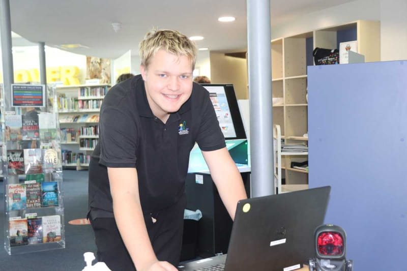 Saturday junior, Kile King, processing the membership check-ins at the entrance to Tin Can Bay Library