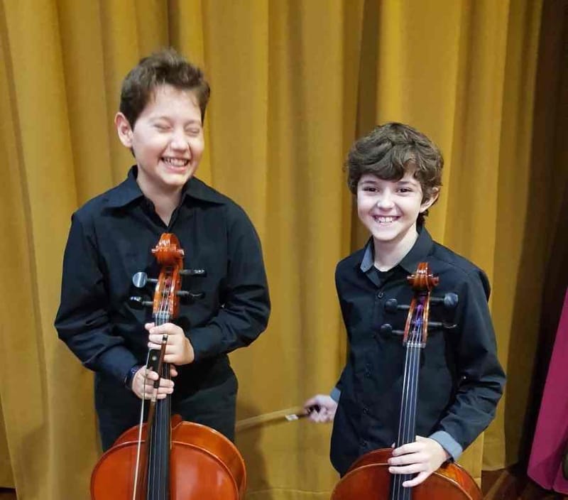 Cheeky young talents Bailey and Callum ready to rock at the recent Cooloola Community Orchestra concert