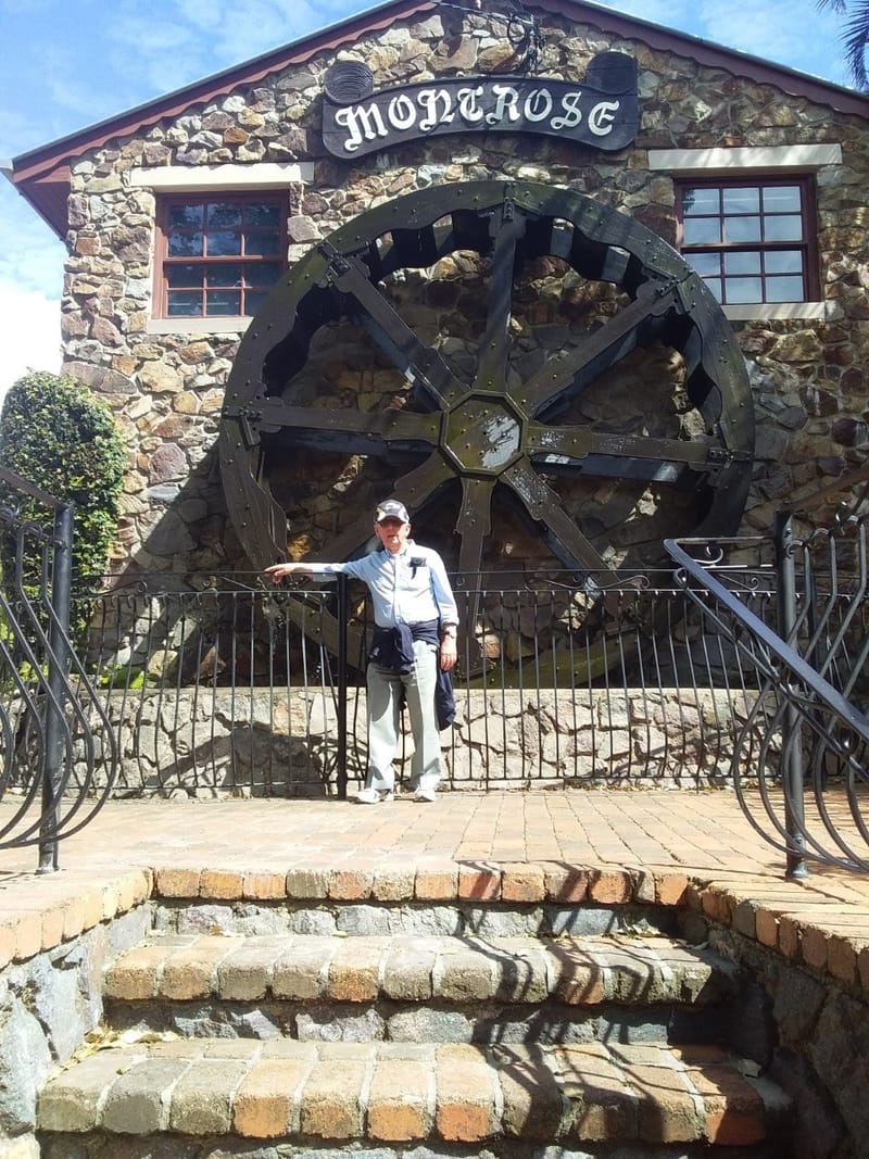 A worn-out Probian (John Olson) leaning up against the fence in front of the Montrose Waterwheel at Montville during a recent