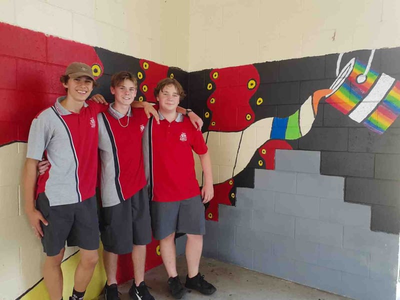 Year 9 students Rakeen, Blake and Mark, who are helping to complete the artwork at the Multi Purpose Space at Tin Can Bay sch