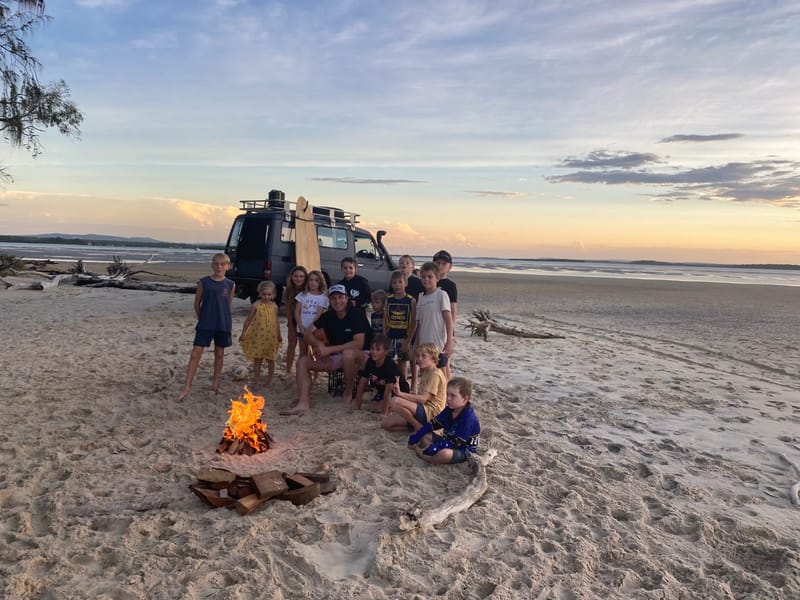 Josh Arnold and some of the RBSS song writers at just one of the beautiful destinations in the Reach for a Rainbow video