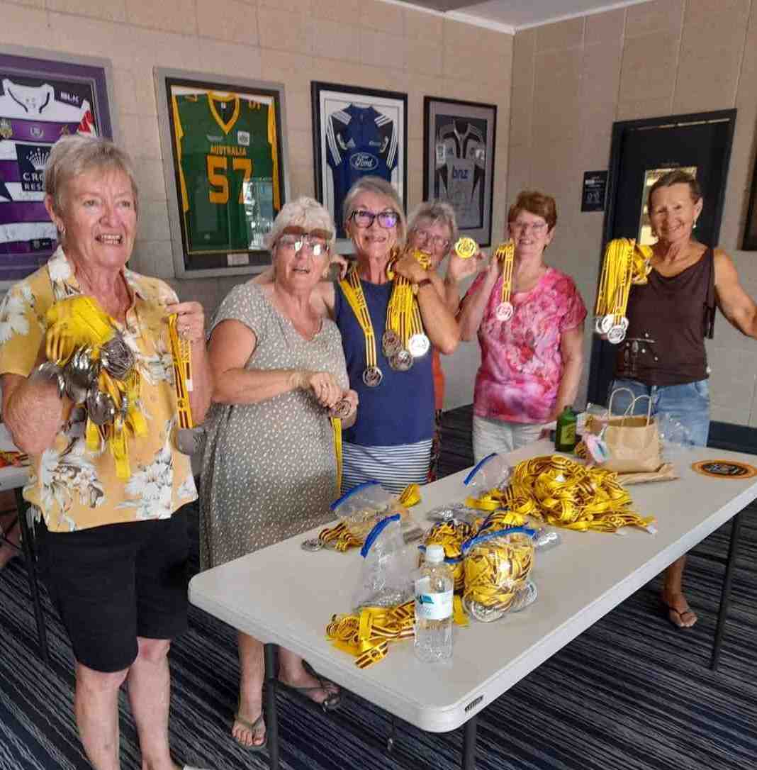 Cooloola Dragons are full of bling at the Queensland Dragon Boat Titles