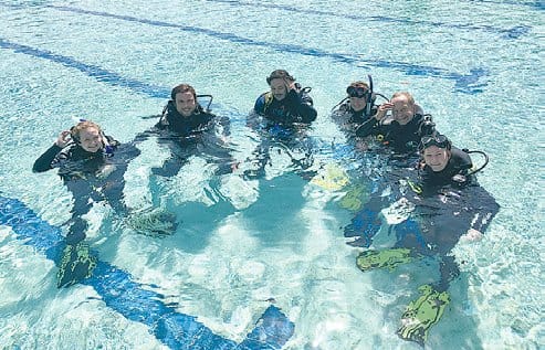 The first step to learning to dive is time spent getting comfortable in the pool